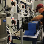 Fabrication Manager installing equipment