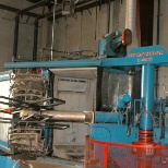 This is one of our smaller machines. The metal arm rotates the mold to spread plastic throughout!