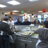 Residents and Senior Members being served food...