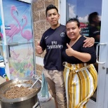 Senior Recruiter Maria Torres with her husband Omar grilling at the employee BBQ.