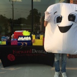 Flossy giving away some free swag to local patients