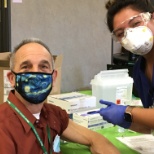 Dr. Seth Ammerman getting his first round of the COVID-19 Vaccine.