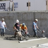 Concrete crew running screed, 2017