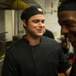 One of our Cooks sharing a laugh with his team.