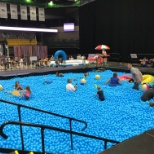 Splashing in the ball pit pool at the Summer Party before enjoying the other treats and attractions.