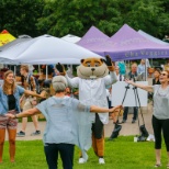 Goldy Gopher joins an outdoor qigong class at the Farmers Market on the Twin Cities campus.