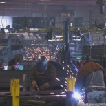 Welders putting together the frames of the RVs