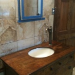 I remodeled this bathroom. This is an old dresser I made into a sink.