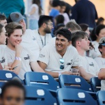 Team mambers enjoying a company outing to the Rock Hounds game