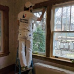 Interior painter painting window trim