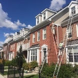 Painting a row of houses for a big project.