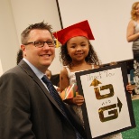 Marketing Director Seth Duke is pictured with a student from Easter Seals at a Waterbury graduation