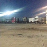 Night picture of parking lot, trailer due for maintenance. And yard spotter