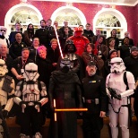 Prospects stand with costumed Star Wars characters at a Friday night premiere.