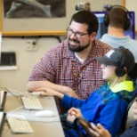 One of our teachers working with a student in the computer lab at our middle school