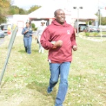 Residential Director Henry Njenga takes a lap on the Walk-a-thon at the Annual Health and Safety Day