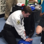 Giving back: Teaching CPR to students.