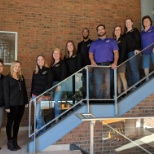 Employees showing off their new Arc shirts