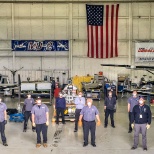 The whole maintenance team wearing masks for COVID-19 in the hangar