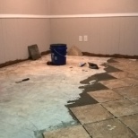 Remove water damaged laminate flooring, Prep concrete sub floor, Install tile in diamond pattern