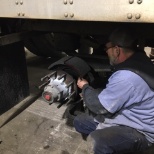 Technician inspecting brakes