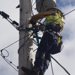 Me on hooks climbing a pole to change and area light