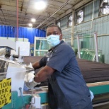 Craig paused for a quick photo before putting glass through the machine to get cut.