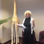 Our VP Patti with Sidney the Giraffe