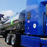 a driver on ladder of one of the newest tanker units