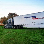 Dorie, a driver for H&M trucking, and her truck.