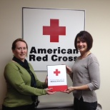 Presenting a thank you plaque for their continued support of the Red Cross.