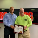 Vincent Floyd presenting the Employee of the Quarter Award