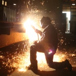 A Carman/Welder working on a rail car.