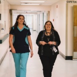 Nurse and site manager walking the halls